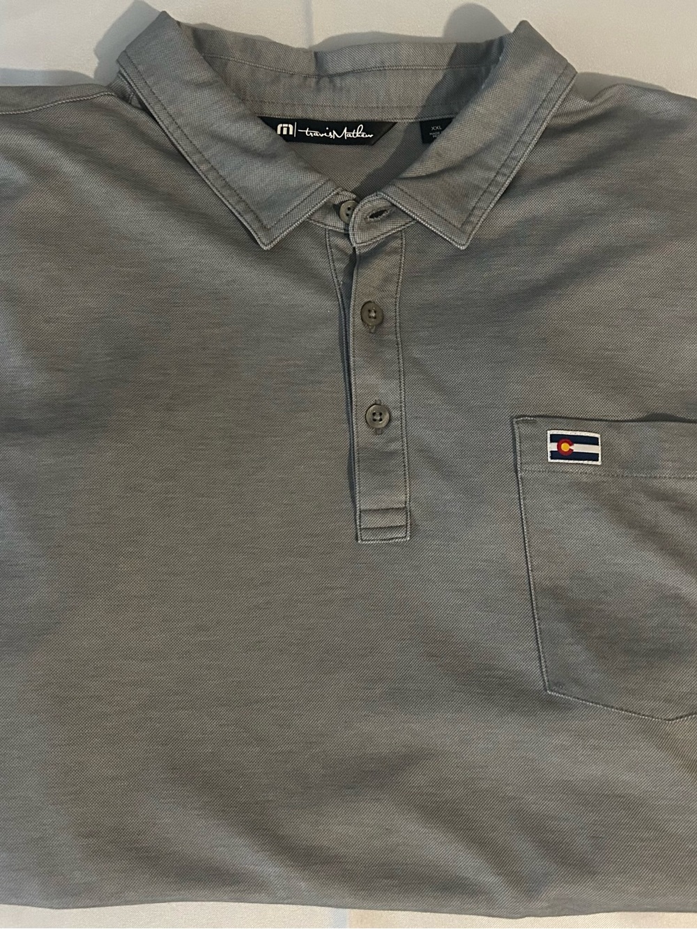 Travis Mathew Men's Slate Gray Polo with Chest Pocket Patch & Camel Sleeve Logo